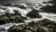 Placeholder: Winter's Rocky Coastline A rugged, rocky coastline battered by a fierce winter storm. The waves crash against the rocks, showcasing nature's raw power and untamed beauty.