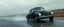 Placeholder: a high definition screen shot of a jet-fighter vw-beetle, retrofuturistic, phototrealism, in flight, one subject, rough weather