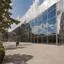 Placeholder: The museum's exterior facade is made of modern mirrors