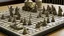 Placeholder: A chessboard with holes in it with tanks and soldiers on it