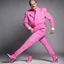 Placeholder: Et voila: John Cleese with massive muscles in a pink battlesuit pink gloves and pink high heel boots. The Ministry of Silly Walks.