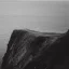 Placeholder: loneliness, emptiness, darkness, remoteness, cliff face on the coastline