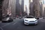 Placeholder: A Tesla 'Model S' is racing at top speed, on 'Wall Street', in New York. (CINEMATIC, WIDE ANGLE LENS, PHOTO REAL)