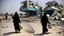 Placeholder: A Palestinian woman wearing a dress carrying very large bags of flour on her back, bending her back down in the destroyed Gaza City, and aid boxes descending from planes near the sea, with a large number of children looking up.