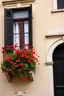 Placeholder: A classic old building with a balcony filled with red poppies growing out of it