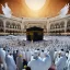 Placeholder: The scene in Mecca: People wearing white Ihram clothes, men without head coverings, women with veils, circumambulating around the Kaaba, and above them are transparent white spirits of children, men, and women with wings revolving around the Kaaba.