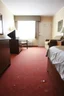 Placeholder: cheap motel room floor, furniture dents in carpet, showing that furniture had been moved