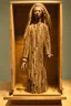 Placeholder: a statue of a woman made of driftwood in a wooden box by assemblage artist "Betye Saar"