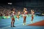 Placeholder: in olympic games a few 100m runner ladyes waiting in start pose to start the game