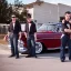 Placeholder: a 50s Greaser BAND standing in front of a hot rod