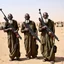 Placeholder: make a picture of 3 poor looking black men in a desert. they are in afghanistan. behind them is a raided village they are holding rifles. they look very very dangerous and have long white beards