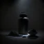 Placeholder: Realistic photograph of a dark studio with a protein shaker. High resolution.