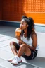 Placeholder: a woman sitting in a basketball court and eating ice cream