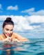 Placeholder: close up shot of very beautiful model girl swimming in water wearing swim suit ,country side ,nice cloudy sky,country houses