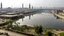 Placeholder: A modern view of Khambhat, showcasing its industrial sector with factories, workers, and the skyline reflecting economic growth.