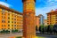 Placeholder: An orange colored tower in an electrical city designed in Moroccan rug art painted by Gustav Klimt