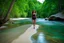 Placeholder: beautiful girl walking toward camera in trees next to wavy river with clear water and nice sands in floor.camera capture from her full body front