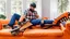 Placeholder: man uses chainsaw on brand new couch in living room