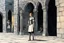 Placeholder: [middle age art by Jason and the Argonauts (1963)] at nightfall: lonely youthful Joan of arc in her armour in the courtyard of the Royal Court in Chinon for an audience with Charles, the King of France at the age of 17. the guards open the gates of the city