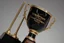 Placeholder: The trophy stands about 12 inches tall, and the base is a shiny, black marble pedestal with a silver plate on it, bearing the inscription "Champion's Triumph" in bold, elegant letters.
