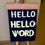 Placeholder: A sign that says 'Hello World'.