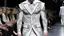 Placeholder: His designs were like the precise incisions of a surgeon, cutting through the chaos of the city