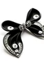 Placeholder: Black tie Contains silver brooch