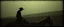 Placeholder: John Atkinson Grimshaw 19th-century gothic photography, Zdzisław Beksiński surrealism, Caravaggio chiaroscuro, tactile analog grain, pinhole-camera softness, heavy vignetting, scratched emulsion, rugged irregular photo border. SCENE: alien cowboy, completely absorbed in the mundane task.