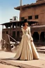 Placeholder: [Movie Poster: in letters: ONCE UPON A TIME IN TE WEST] Claudia Cardinale in her iconic scene of Once Upon a Time in the West (1868): the western train station behind her she discovers the small cowboy city in construction, in the dust. She observes, a shawl draped over her lace-trimmed bourgeois dress, her hair pulled back into a tousled bun. there is dust in the air