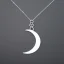 Placeholder: Clear polyester necklace with a silver pendant in the shape of a crescent moon