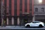 Placeholder: A Tesla 'Semi' (semi truck) is parked, near the building of the 'Friends' series in New York. (CINEMATIC, WIDE ANGLE LENS, PHOTO REAL)