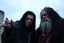Placeholder: Grima Wormtongue with black hair, and Theoden.