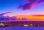 Placeholder: Honolulu Hawaii hotels covered in winter snow and ice at sunset, bright colors, winter wonderland