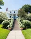 Placeholder: A White House with FlowerAdorned Sweeping Staircase.