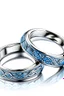 Placeholder: White gold couple rings in the shape containing diamonds blue For the wedding