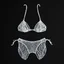 Placeholder: 2d yarn and string art, minimalism, bikini top and bottoms made entirely out of white string, dark negative space, extreme contrast, concept art, stunning, dramatic, intricate details, string textures,