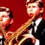 Placeholder: eyes closed REd-haired ron howard as richie from happy days Is playing the saxophone mouthpiece with his "eyes closed", rock band, looking at camera