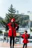 Placeholder: full body shot of beautiful lady with her 4 years old duather in jacket and pants standing simple background