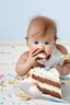 Placeholder: baby hiding eating cake