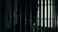 Placeholder: close up parallel prison window bars in foreground, hidden dark human face partially visible through the window bars, pale light, dark prison cell behind them,, shadows in background, ultra realistic, dark atmosphere, high contrast shadows, dark vibe