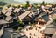 Placeholder: Diorama style birds-eye toy-like tilt shift image of 1500s Japanese noble village with market square and people