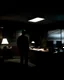 Placeholder: Imagine a scenario where the footage captures a man in a dimly lit office late at night, his shadowy figure moving mysteriously across the room. The flickering lights create an eerie, security camera vision frame