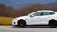 Placeholder: A Tesla's 'Model S Plaid' is racing at top speed, across the 'Great Smoky Mountains' National Park, in Tennessee. CINEMATIC. WIDE ANGLE LENS. PHOTO REAL.