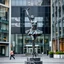 Placeholder: photo of a statue of ballerina made of black marbel in a modern city center