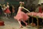 Placeholder: A female dancer in a rose pink factory painted by Edgar Degas