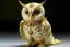 Placeholder: owl sculpture made of gold wire, real pearls, driftood and cotton balls