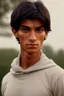 Placeholder: Appearance: Ari has a mixed-race skin tone with a light brown complexion. He has dark hair in a page boy haircut, and his hair length could be somewhere in-between long and short. His face is thin with high cheekbones and dark eyes that are often full of emotion. He stands at around 5 feet 7 inches tall, with a lean build that suggests he doesn't engage in a lot of physical activity.