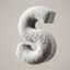 Placeholder: Retro shot of a letter S sculpted from soft ,plush fabric, floating in mid-air with a warm gray hue