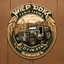 Placeholder: Truck Door Logo for a wheat farm, featuring a tractor and wheat, text "Pozniak Farms"