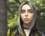 Placeholder: Billie Eilish, sitting on a chair, Black Short Dress, high detail, realistic, 8k